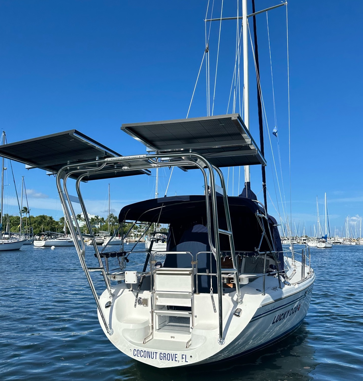 Catalina 34 Sail Arch with solar panels at a marina